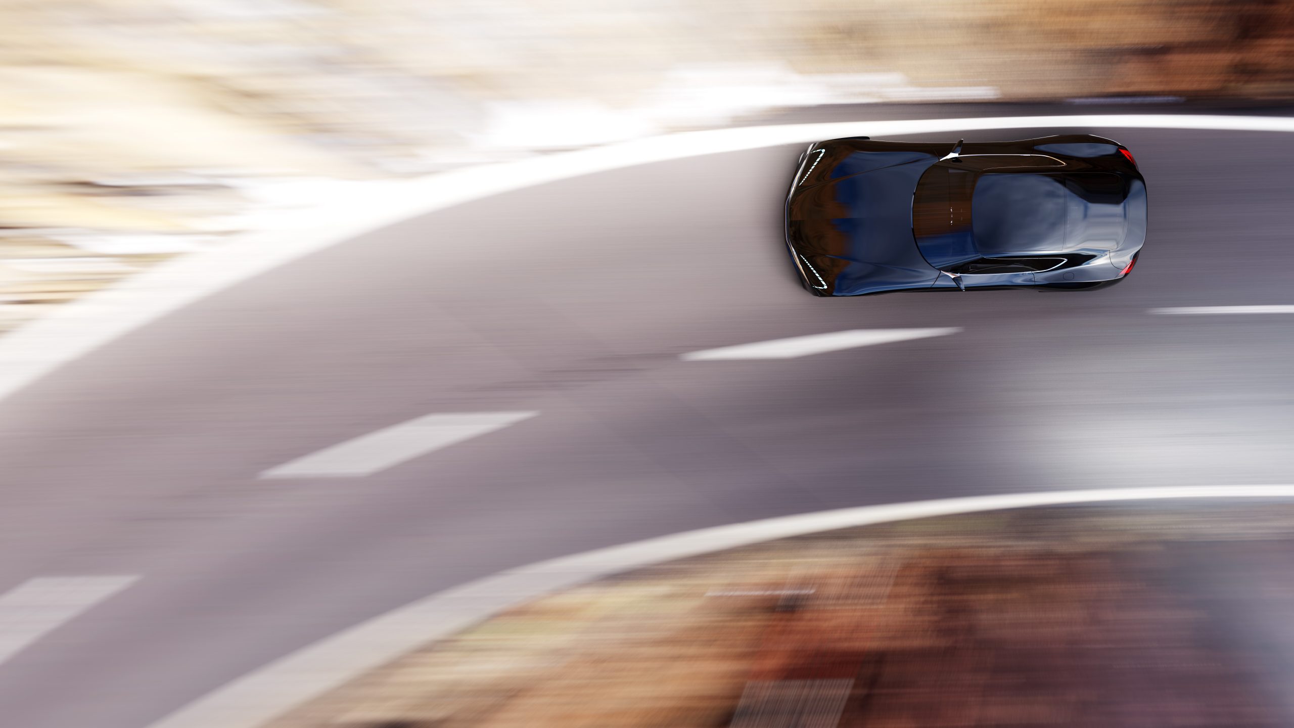 black car driving on a mountain road